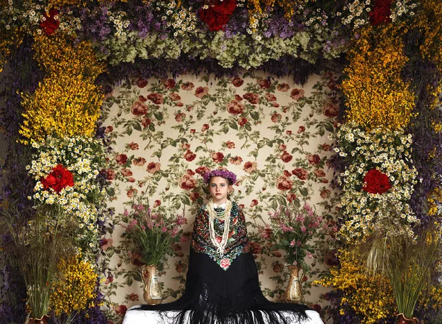 “La Maya Tradition”. People, second prize stories. Daniel Ochoa de Olza, Spain, AP. Young girls between the age of 7 and 11 are chosen every year as “Maya” for the “Las Mayas”, a festival derived from pagan rites celebrating the arrival of spring, in the town of Colmenar Viejo, Spain, May 2, 2015. The girls are required to sit still for a couple of hours in a decorated altar. (Photo by Daniel Ochoa de Olza/World Press Photo Contest)