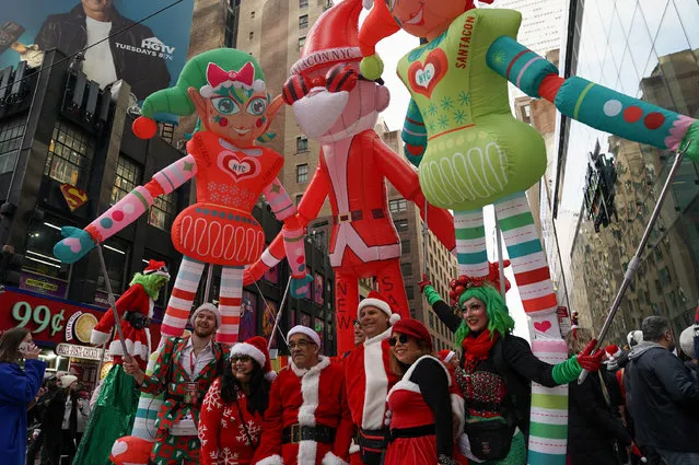 Revellers take part in SantaCon in New York City, New York, U.S., December 9, 2023. (Photo by David Dee Delgado/Reuters)