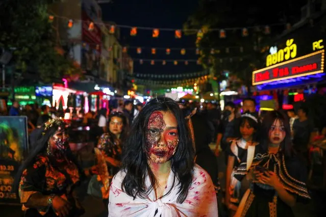 Participants wearing costumes attend Halloween night at Khaosan Road, a hub for backpackers, in Bangkok, Thailand on October 31, 2023. (Photo by Chalinee Thirasupa/Reuters)