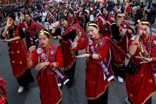 Members of the indigenous Gurung community wearing traditional attire dance on the occasion of 'Tamu Lhosar' festival marking the commencement of Gurung new year in Kathmandu on December 31, 2023. (Photo by Prakash Mathema/AFP Photo)
