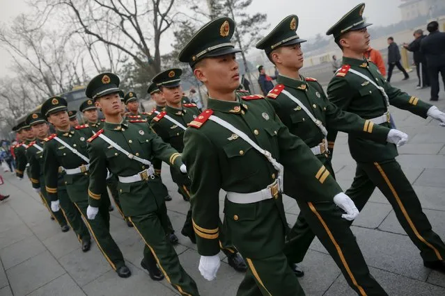 Paramilitary policemen march at Tiananmen square as the area near the Great Hall of the People is prepared for the upcoming annual sessions of the National People's Congress (NPC) and Chinese People's Political Consultative Conference (CPPCC) in Beijing, China March 3, 2016. (Photo by Damir Sagolj/Reuters)
