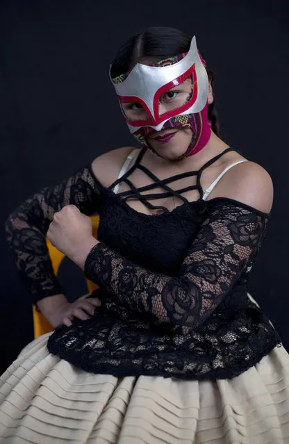 Young cholita wrestler Lucero la Bonita strikes a pose for a portrait before fighting in the ring in El Alto, Bolivia, Sunday, February 10, 2019. “I love to promote the culture of my country”, said the 16-year-old fighter, one of 50 from a new generation of cholita fighters in training. (Photo by Juan Karita/AP Photo)
