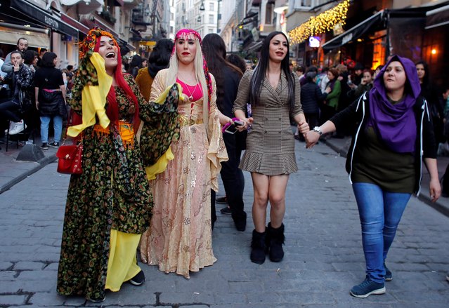 People dance in side streets, after police blocked the entrance to the main street, at a march marking International Women's Day in Istanbul, Turkey on March 8, 2019. (Photo by Murad Sezer/Reuters)