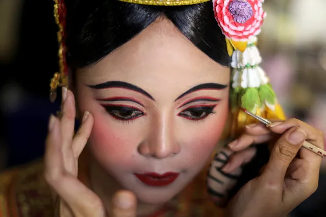 Dancers get ready backstage before a performance of masked theatre known as Khon which was recently listed by UNESCO, the United Nations' cultural agency, as an intangible cultural heritage, along with neighbouring Cambodia's version of the dance, known as Lakhon Khol at the Thailand Cultural Centre in Bangkok, Thailand on November 7, 2018. (Photo by Jorge Silva/Reuters)