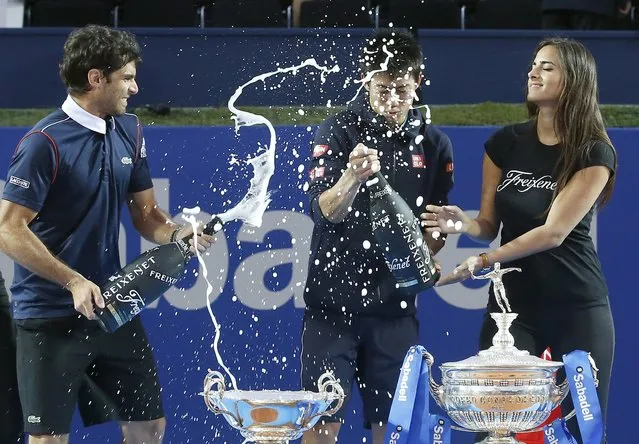 Kei Nishikori (C) of Japan sprays champagne after he beat Pablo Andujar (L) of Spain to win the Barcelona Open tennis tournament in Barcelona April 26, 2015. (Photo by Gustau Nacarino/Reuters)