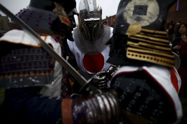 Members of the Japanese team prepare before competing in the Medieval Combat World Championship at Malbork Castle, northern Poland, April 30, 2015. (Photo by Kacper Pempel/Reuters)