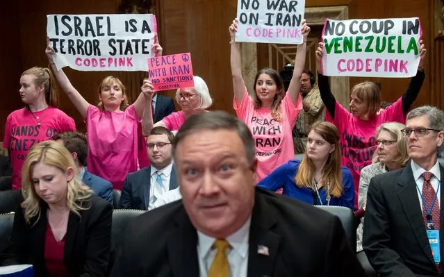 Codepink protestors hold signs as US Secretary of State Mike Pompeo arrives to testify during a Senate Appropriations on State, Foreign Operations and Related Programs Subcommittee hearing on the proposed budget for fiscal year 2020, on Capitol Hill in Washington, DC on April 9, 2019. (Photo by Saul Loeb/AFP Photo)
