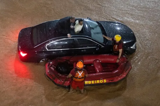 Heavy rain is flooding several streets in the central region of Sao Paulo, leaving people stranded in Sao Paulo, Brazil, on March 5, 2024. (Photo by FotoRua/NurPhoto/Rex Features/Shutterstock)