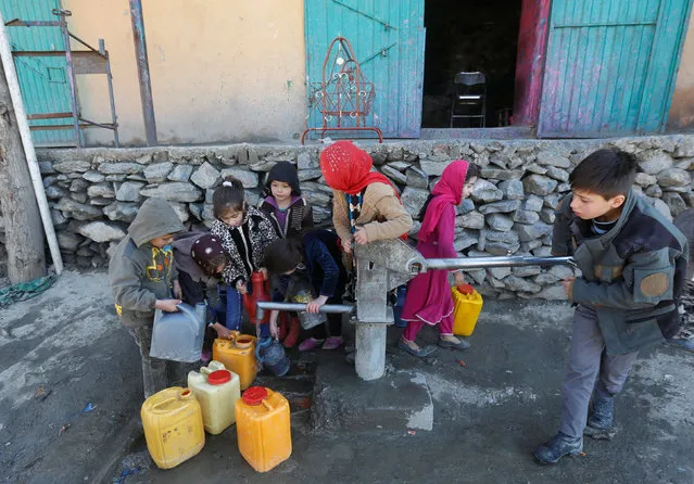 Afghan children collect water from a public water pump in Kabul, Afghanistan February 20, 2017. (Photo by Omar Sobhani/Reuters)