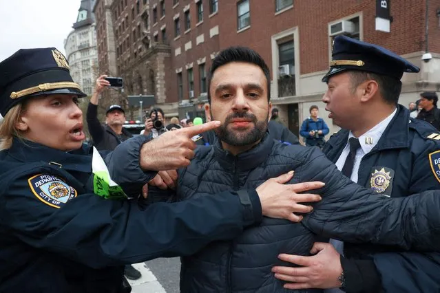 A demonstrator is detained during a protest in solidarity with Pro-Palestinian organizers on the Columbia University campus, amid the ongoing conflict between Israel and the Palestinian Islamist group Hamas, in New York City, U.S., April 18, 2024. (Photo by Caitlin Ochs/Reuters)