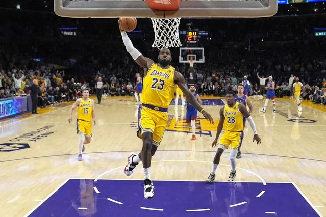 Los Angeles Lakers forward LeBron James (23) dunks during the first half of Game 3 of an NBA basketball first-round playoff series against the Denver Nuggets in Los Angeles, Thursday, April 25, 2024. (Photo by Ashley Landis/AP Photo)