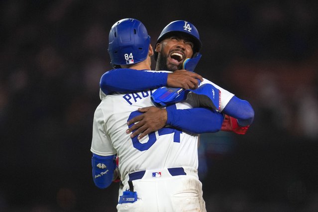 Los Angeles Dodgers' Andy Pages (84) celebrates with Teoscar Hernández after a single during the eleventh inning of a baseball game against the Atlanta Braves in Los Angeles, Friday, May 3, 2024. Will Smith scored. The Dodgers won 4-3. (Photo by Ashley Landis/AP Photo)