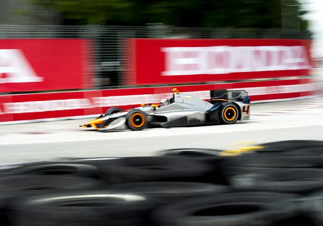 Stefano Paulo, of Brazil, makes a corner during practice for the IndyCar auto race Saturday, June 13, 2015, in Toronto. (Nathan Denette/The Canadian Press via AP)