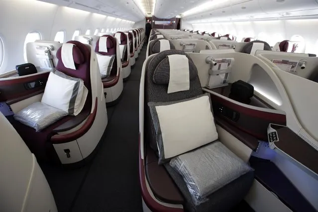 Interior view of the Business Class seats on the second floor deck of the Airbus A380 of Qatar Airways presented at the Paris Air Show, in Le Bourget airport, north of Paris, Wednesday, June 17, 2015. Qatar Airways has brought 4 Airbus A380's in service since last year. (AP Photo/Francois Mori)