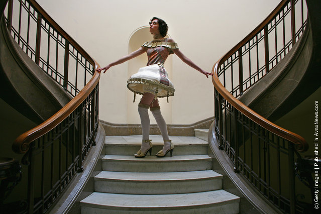 A student poses as performance costume students from the Edinburgh college of art hold a preview of their creations