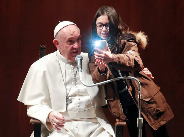 A girl takes a selfie with Pope Francis during a visit to the parish of St. Mary Josefa of the Heart of Jesus in Rome, Italy February 19, 2017. (Photo by Remo Casilli/Reuters)