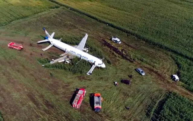 In this video grab provided by the RU-RTR Russian television, a Russian Ural Airlines' A321 plane is seen after an emergency landing in a cornfield near Ramenskoye, outside Moscow, Russia, Thursday, August 15, 2019. Russian Ural Airlines' A321, carrying 226 passengers and a crew of seven, collided with a flock of birds while taking off Thursday rfom Moscow's Zhukovsky airport. Russian health authorities said that 23 people, including five children, have been hospitalized with injuries. (Photo by RU-RTR Russian Television via AP Photo)