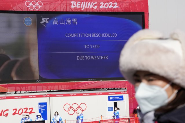 The board shows a delay due to weather for the start of the men's downhill at the 2022 Winter Olympics, Sunday, February 6, 2022, in the Yanqing district of Beijing. (Photo by Luca Bruno/AP Photo)