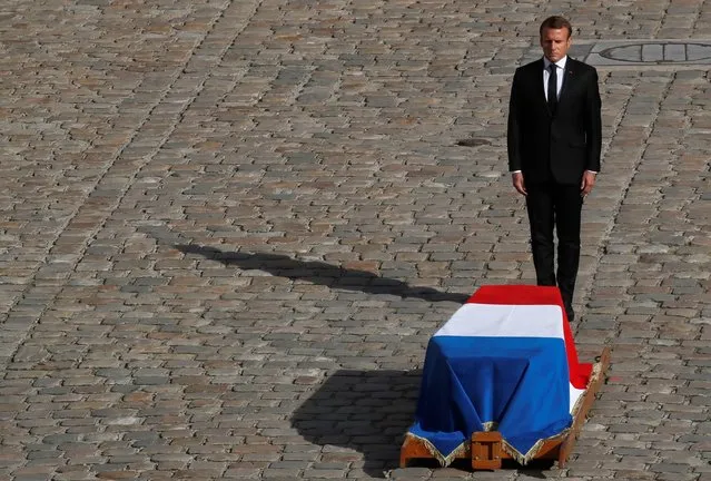 French President Emmanuel Macron stands in front of the coffin of former French president Jacques Chirac during a military tribute at the Invalides (Hotel des Invalides) in Paris on September 30, 2019. Former French President Jacques Chirac died on September 26, 2019 at the age of 86. (Photo by Gonzalo Fuentes/Reuters)