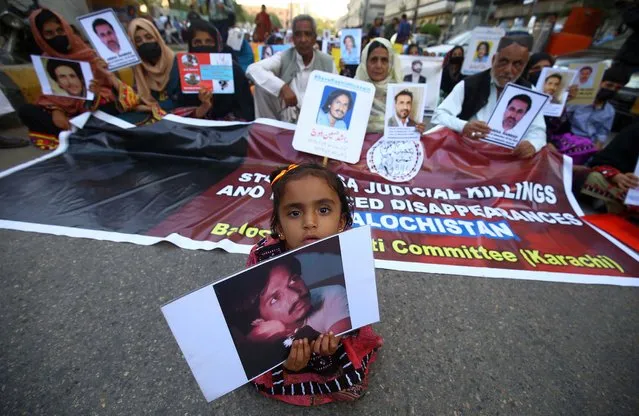 Family members hold pictures of their missing relatives during a protest demanding the deliverance of their relatives, in Karachi, Pakistan, 16 feburay 2022. People demanded the deliverance of their missing relatives whom Pakistani human rights activists claim have been picked up by state agencies, primarily under the pretext of fighting terrorism. (Photo by Shahzaib Akber//EPA/EFE)