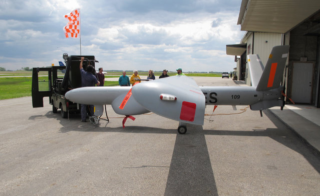 An Israeli-built Elbit Systems Hermes 450 unmanned aircraft is towed out of a hangar at the Hillsboro, N.D. airport on Friday, May 20, 2016, before its first flight to collect agriculture data. It is believed to be the first drone of its type to be tested in the United States, as part of a joint project between North Dakota State University and the Northern Plains UAS Test Site. (Photo by Dave Kolpack/AP Photo)