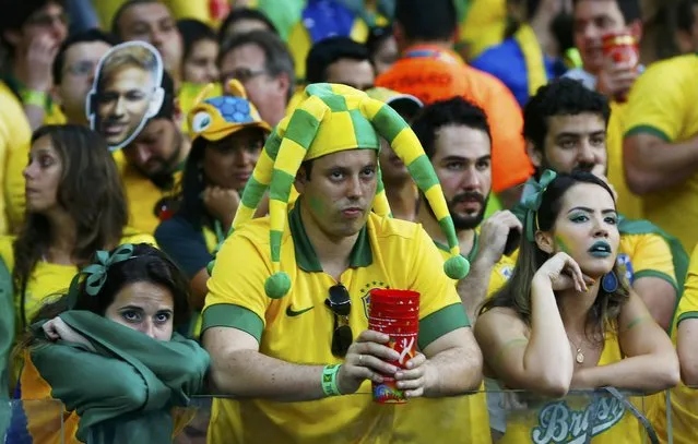 Fans of Brazil react during their 2014 World Cup semi-finals against Germany at the Mineirao stadium in Belo Horizonte July 8, 2014. (Photo by Eddie Keogh/Reuters)
