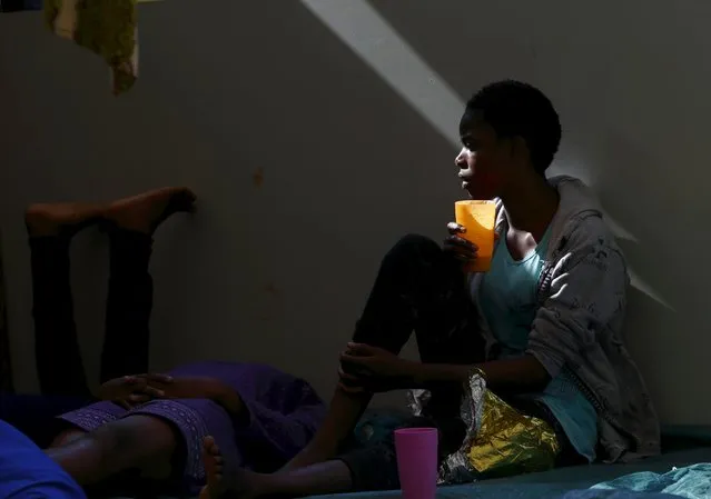A migrant drinks water on the deck of the Medecins san Frontiere (MSF) rescue ship Bourbon Argos somewhere between Libya and Sicily August 8, 2015. (Photo by Darrin Zammit Lupi/Reuters)