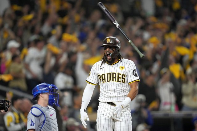 San Diego Padres' Fernando Tatis Jr. tosses his bat after hitting a two-run home run during the second inning in Game 3 of a baseball NL Division Series against the Los Angeles Dodgers, Tuesday, October 8, 2024, in San Diego. (Photo by Ashley Landis/AP Photo)