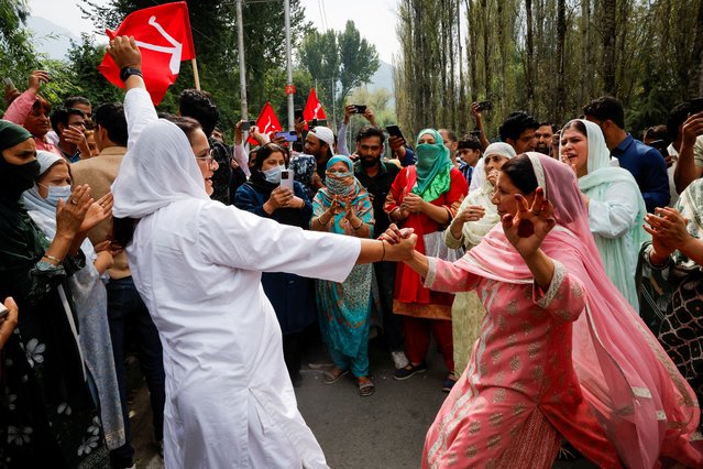 Supporters of the Jammu and Kashmir National Conference party celebrate outside the vote counting centre on the day of the assembly election results, in Srinagar, on October 8, 2024. (Photo by Sharafat Ali/Reuters)