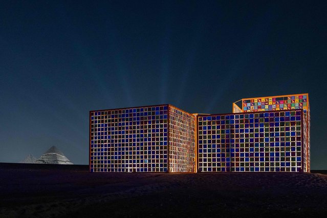 This handout picture provided by Art d'Egypte shows a night view of an art installation by visual artist Ik Joong Kang titled “Four Temples” during the fourth edition of the “Forever is Now” art exhibition by Art d'Egypte at the Giza pyramids necropolis on October 26, 2024. (Photo by Walaa Ismail/Art d'Egypte via AFP Photo)