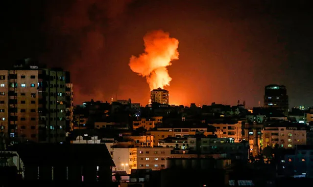 A picture taken on February 24, 2020, shows an explosion following an Israeli airstrike on Gaza City. Gaza militant group Islamic Jihad announced the end of its “military response” against Israel after a two-day exchange of fire just a week before the Jewish state's March 2 election. There was no immediate confirmation of a ceasefire from Israel, and AFP correspondents in the Palestinian enclave said Israeli airstrikes were ongoing early Monday evening. (Photo by Mahmud Hams/AFP Photo)