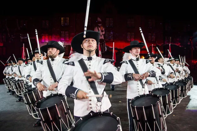 The Top Secret Jubilee Corps, Switzerland perform on stage during the dress rehearsal for the Basel Tattoo, at the Barracks in Basel, Switzerland, late 20 July 2016. The Basel Tattoo is a military music festival held from 21 to 30 July in the city of Basel. (Photo by Patrick Straub/EPA)