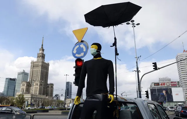 A symbol of male support is seen as women, self isolated in their cars to protect against coronavirus, take part in a protest against plans for the parliament to debate a draft law tightening Poland's ban on most abortions this week, in Warsaw, Poland, Tuesday, April 14, 2020. (Photo by Czarek Sokolowski/AP Photo)