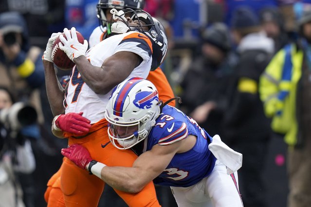 Buffalo Bills wide receiver Mack Hollins (13) hits Denver Broncos wide receiver Marvin Mims Jr. (19) on a kickoff during the second quarter of an NFL wild card playoff football game, Sunday, January 12, 2025, in Orchard Park, N.Y. (Photo by Seth Wenig/AP Photo)