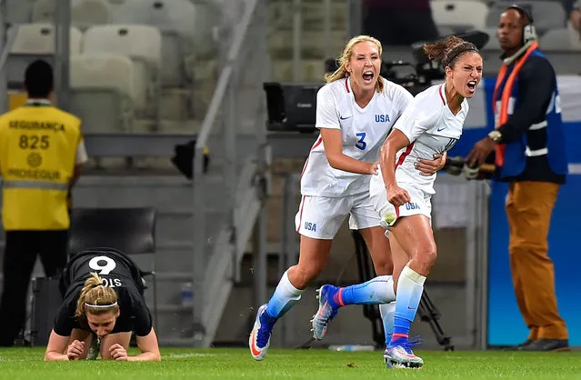 Carli Lloyd #10 of United States and Allie Long #3 of United States celebrate after Lloyd scores in the first half  in the Women's Group G first round match between the United States and New Zealand during the Rio 2016 Olympic Games at Mineirao Stadium on August 3, 2016 in Belo Horizonte, Brazil. (Photo by Pedro Vilela/Getty Images)
