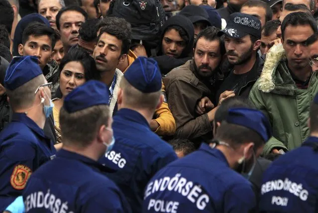 The police tries to maintain order at the Keleti station in Budapest, Hungary September 10, 2015. (Photo by Bernadett Szabo/Reuters)