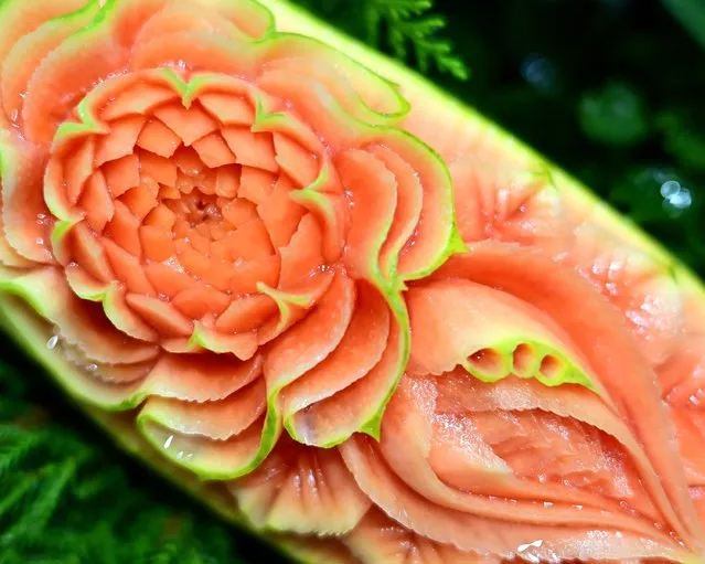 A carved papaya is displayed during a fruit and vegetable carving competition at the 26th Thailand International Culinary Cup in Bangkok on September 21, 2022. (Photo by Manan Vatsyayana/AFP Photo)