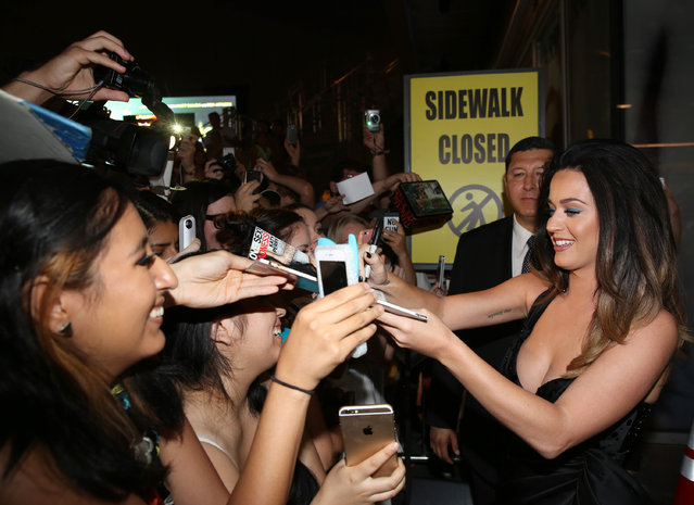 Katy Perry signs autographs at the World Premiere of JEREMY SCOTT: THE PEOPLE'S DESIGNER, presented by The Vladar Company and Quintessentially at the TCL Chinese Theatre on Tuesday, September 8, 2015, in Hollywood, Calif. (Photo by Matt Sayles/Invision for The Vladar Company/AP Images)