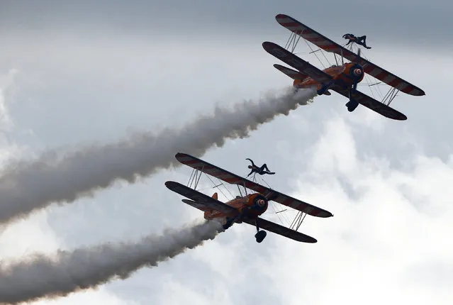 Breitling Wingwalker aircrafts perform during the Air14 airshow at the airport in Payerne, Switzerland, August 31, 2014. (Photo by Denis Balibouse/Reuters)