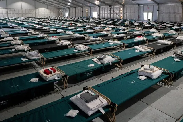 The dormitory for the temporarily housed migrants at the Humanitarian Emergency Response and Relief Center, which is designed to process and temporarily house migrants arriving from other states on Randall's Island in New York City, New York, U.S., October 18, 2022. (Photo by David “Dee” Delgado/Reuters)