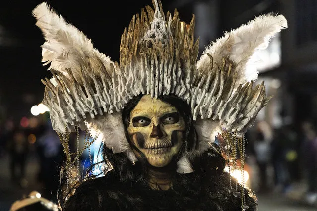 A woman dresses up as part of the preparations for “Day Of The Dead” in Mexico on October 29, 2022 in Tenancingo de Degollado, Mexico. Considered one of the most representative traditions, the day of the dead takes place during the first two days of November. Mexicans prepare to have full celebrations after two years of restrictions due to the coronavirus pandemic. (Photo by Cristopher Rogel Blanquet/Getty Images)