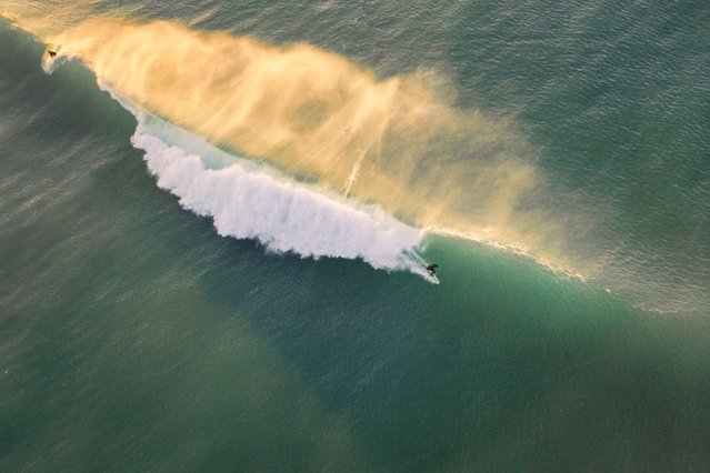 A surfer rides a wave at Fistral beach in Newquay, Cornwall, UK on January 19, 2025. (Photo by Brad Wakefield/The Times)