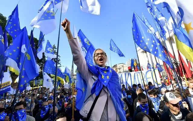 Opposition supporters protest against a bill to limit Ukrainian language in schools outside the parliament in Kiev on July 16, 2020. A deputy in the party of President Volodymyr Zelensky has proposed legislation that would reduce the use of Ukrainian language in schools. A large proportion of the population speaks Russian, which was the dominant language in the Soviet Union and the Tsarist era. Critics of the bill say it paves the way for the “total Russification of education”. (Photo by Sergei Supinsky/AFP Photo)