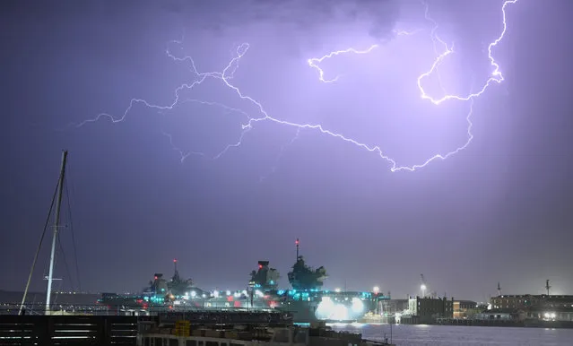Pictured is a lightning storm over Portsmouth Harbour in Hampshire which started late Sunday evening past midnight into Monday, September 5, 2022. The storm brought with it torrential rain, lighting up the sky with flashes every few seconds. (Photo by Paul Jacobs/pictureexclusive.com)