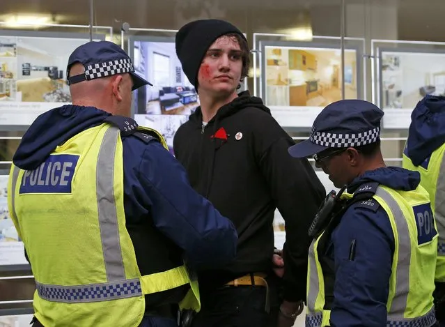 Police detain a student during a demonstration to protest against cuts to grants, in London, Britain November 4, 2015. (Photo by Peter Nicholls/Reuters)