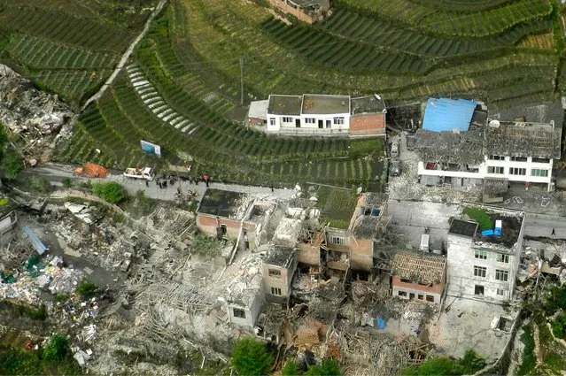 This aerial photo released by China's Xinhua news agency shows destroyed houses after a powerful earthquake hit Taiping town of Lushan County in Ya'an City, southwest China's Sichuan Province, Saturday, April 20, 2013. The powerful earthquake jolted Sichuan province Saturday near where a devastating quake struck five years ago. (Photo by Liu Yinghua/AP Photo/Xinhua)