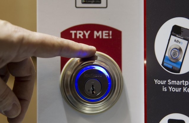 A Kevo smart lock is demonstrated during the 2015 International Consumer Electronics Show (CES) in Las Vegas, Nevada January 4, 2015. The lock, which opens with a smart phone App and a touch, is smart enough to know what side of the door you are on and won't accidentally unlock the door when you are inside. A new subscription service offers unlimited e-keys and other benefits, a representative said. (Photo by Steve Marcus/Reuters)