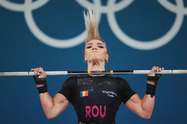 Michaela Valentina Cambei of Romania competes during the women's 49kg weightlifting event at the 2024 Summer Olympics, Wednesday, August 7, 2024, in Paris, France. (Photo by Kin Cheung/AP Photo)