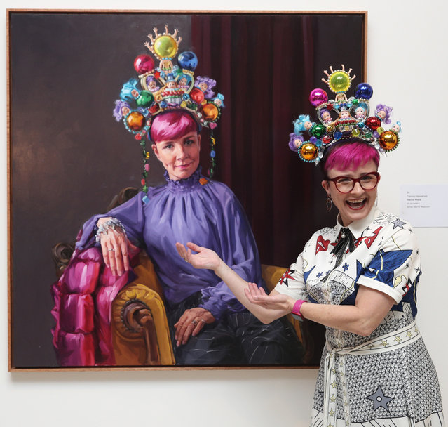 Cal Wilson poses beside Andrea Huelin's Packing Room Prize 2023 portrait of her titled “Clown Jewels” during the 2023 Packing Room Prize announcement on April 27, 2023 in Sydney, Australia. The Packing Room prize is selected by the art packers receiving entries for the Archibald prize. The annual $100,000 Archibald prize is Australia's most famous portrait award. The $50,000 Wynne Prize is awarded to the best landscape painting of Australian scenery or figurative sculpture, while the $40,000 Sulman Prize is given to the best subject painting, genre painting or mural project in oil, acrylic, watercolour or mixed media. (Photo by Don Arnold/WireImage)