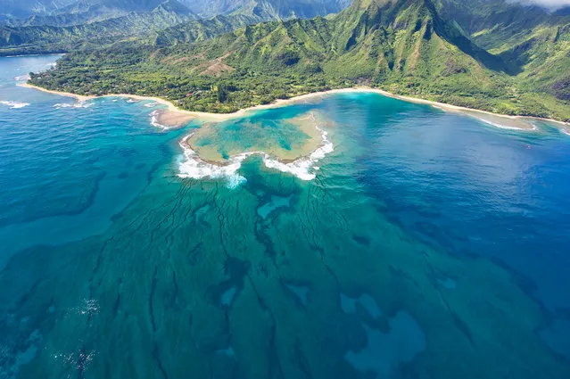 “Tunnels Beach”. The protective coral reef that makes Tunnels Beach a great place for beginners to snorkel & scuba dive can be seen from the air. The beach is located on the island of Kaua'i, Hawai'i. (Photo and caption by Scott Chapman/National Geographic Traveler Photo Contest)